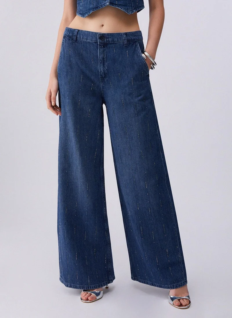 ليو جو Flared jeans with rhinestones